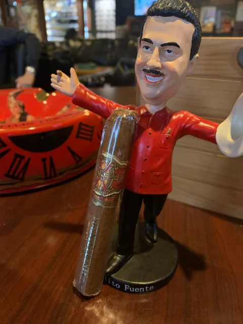 OPUS X 20th Anniversary cigar resting on a Casa Cuba ashtray beside Cuban coffee
